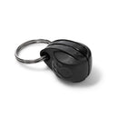 Eine Seitenansicht des schwarzen magnetischen Halsbandanhängers mit der Seite, auf der die Kontaktdaten des Besitzers auf das mitgelieferte Klebepapier geschrieben und in die Rillen des Halsbandanhängers gesteckt werden können